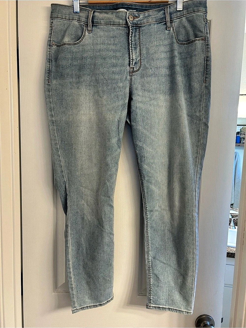 Old Navy Super-Skinny Ankle Mid Rise light blue jeans.